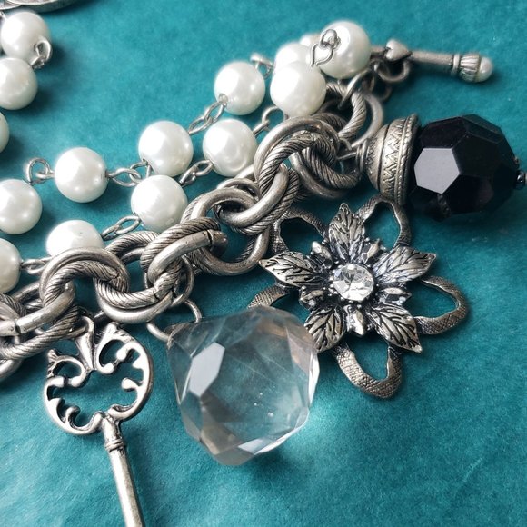 2/25$ Silver tone bracelet with charms and locket - Picture 3 of 5